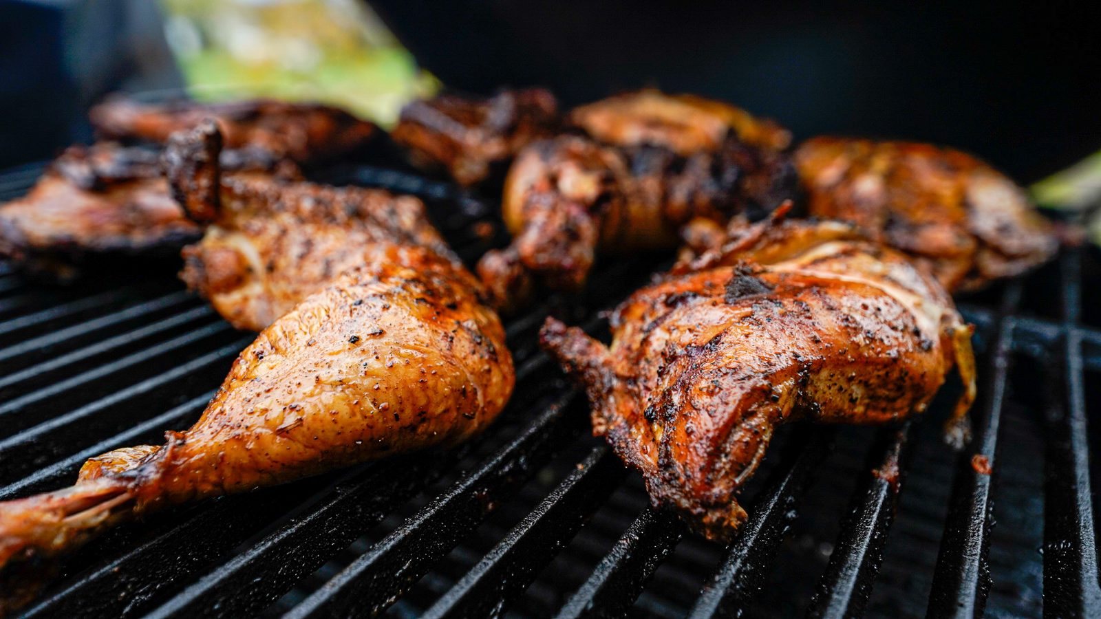 Chicken grilling over the grates