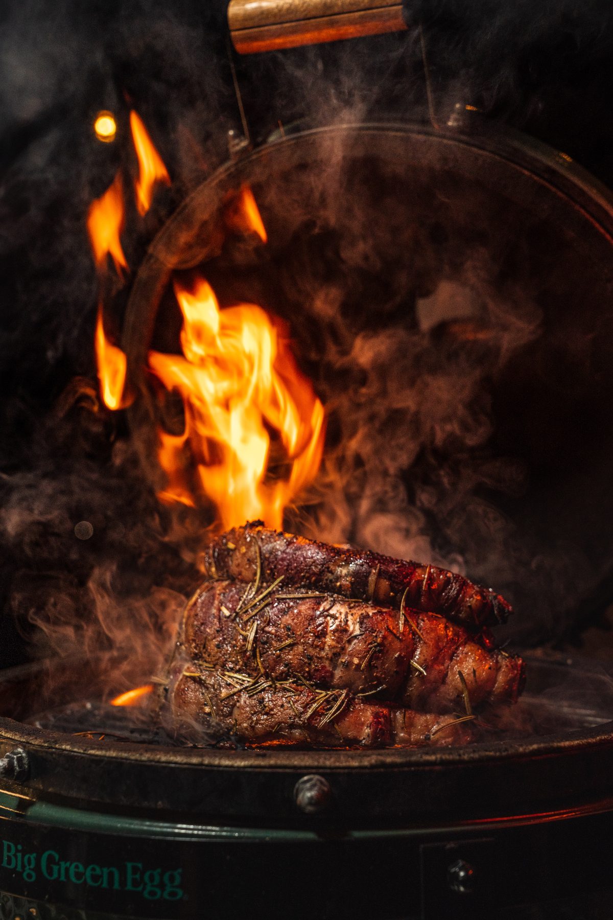 Prime rib seared over flame in a Big Green Egg